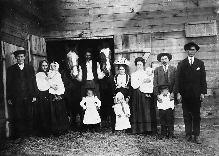 Three generations of Croatian settlers at a barn, about 1910